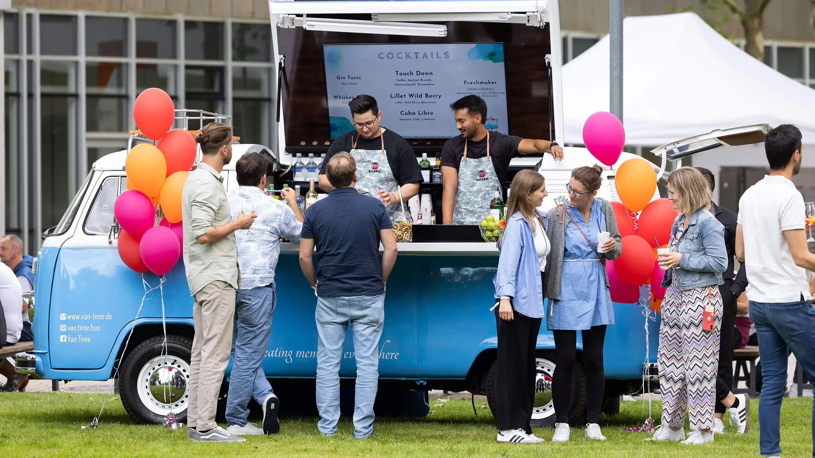 People are buying drinks at a Cocktail Van